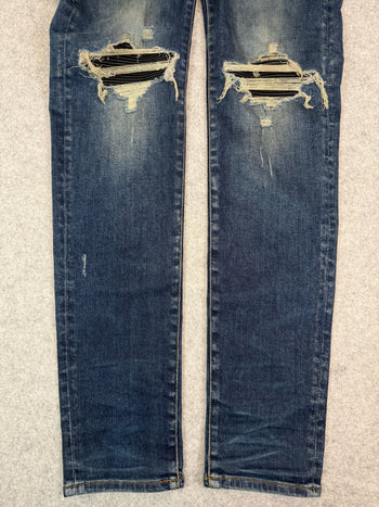 Amiri Ripped Ribbed Denim Jeans (USED)
